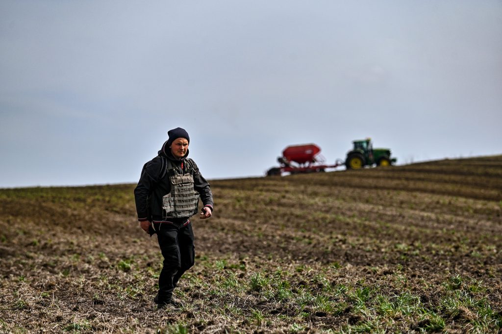 A farmer wears a bulletproof vest during crop sowing which takes place 30 km from the front line in the Zaporizhzhia Region, southeastern Ukraine, on April 8.