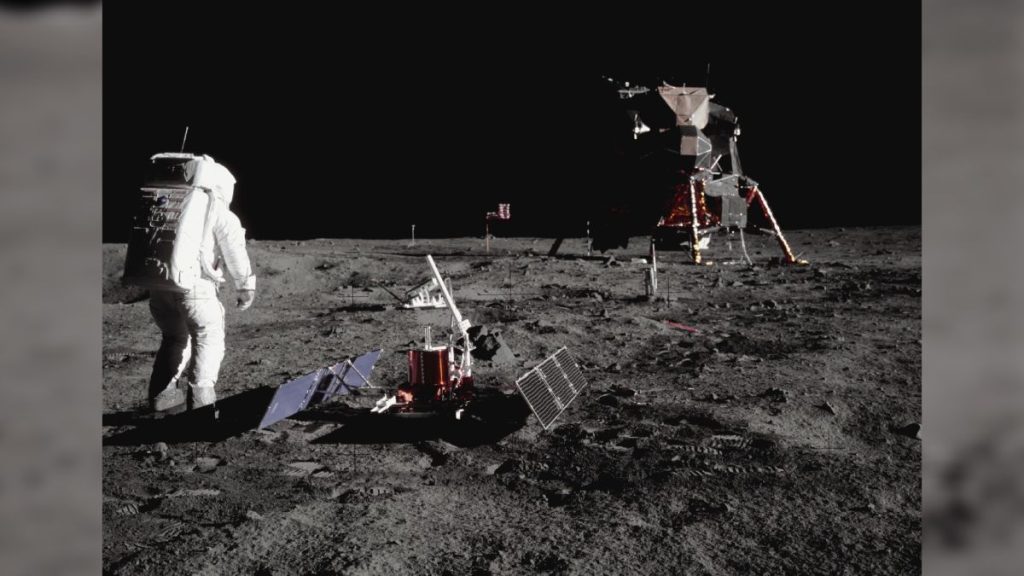 How many people have walked on the moon? Astronaut Buzz Aldrin walking on the moon surrounded by scientific equipment during the Apollo 11 mission